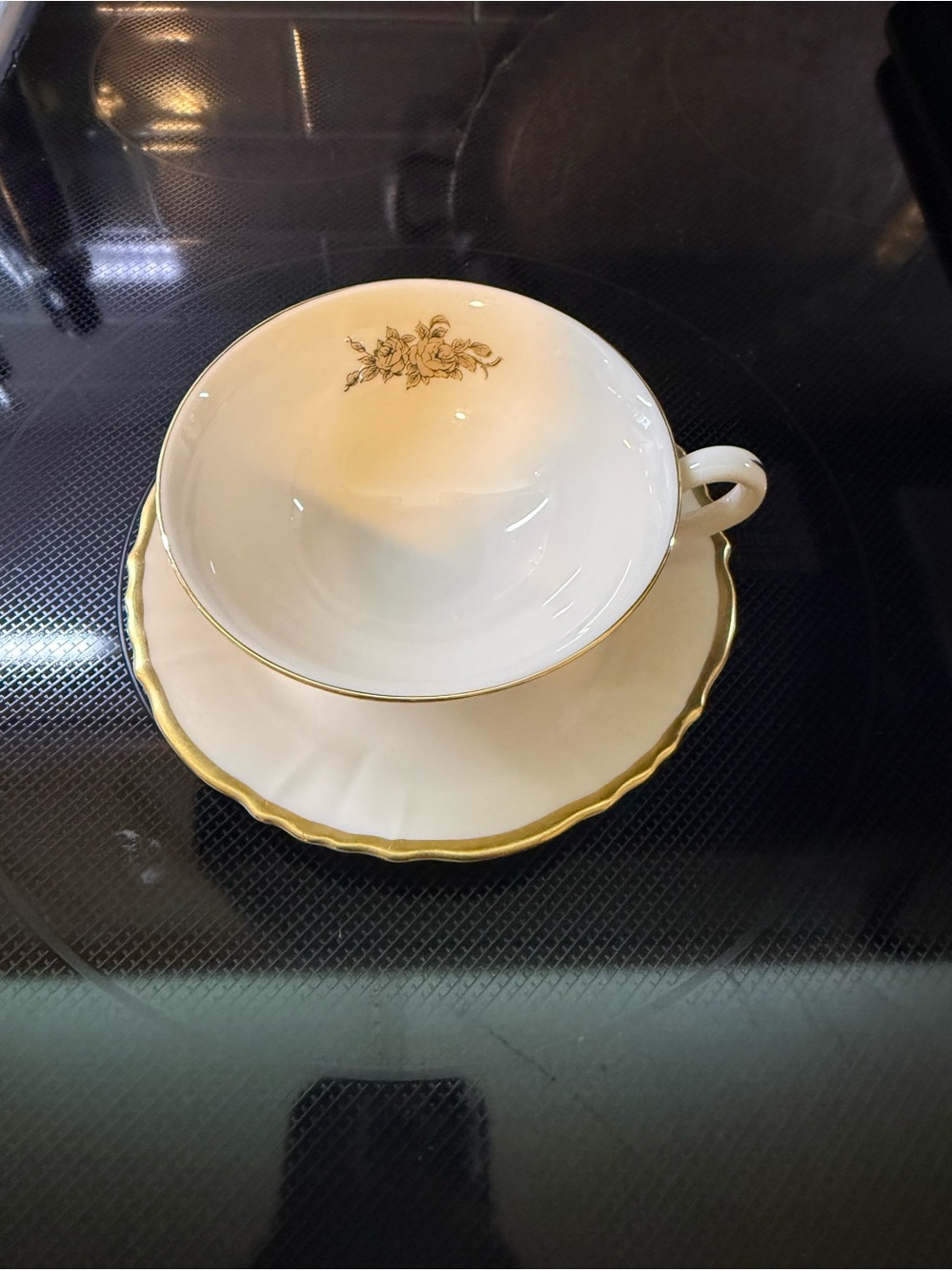 Elegant White and Gold Floral Teacup with Saucer